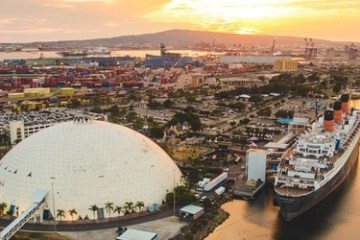 a large body of water with a city in the background